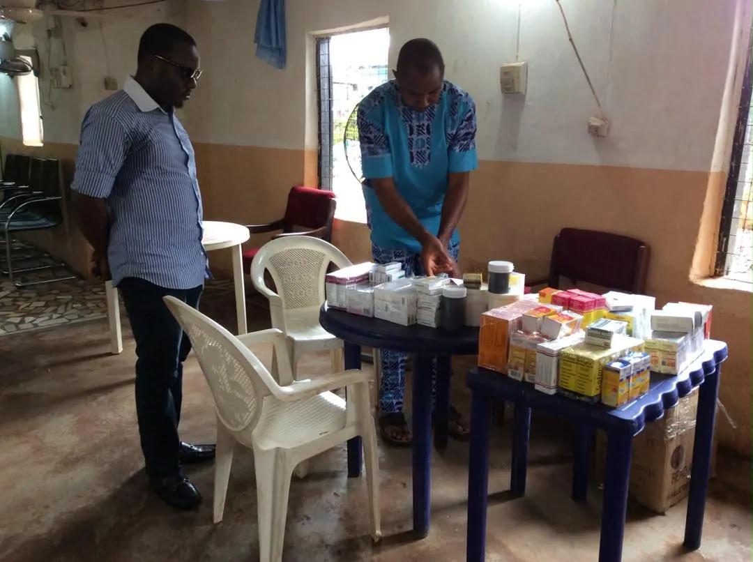 Medicines arranged on a table inside a community hall ahead of consultations.